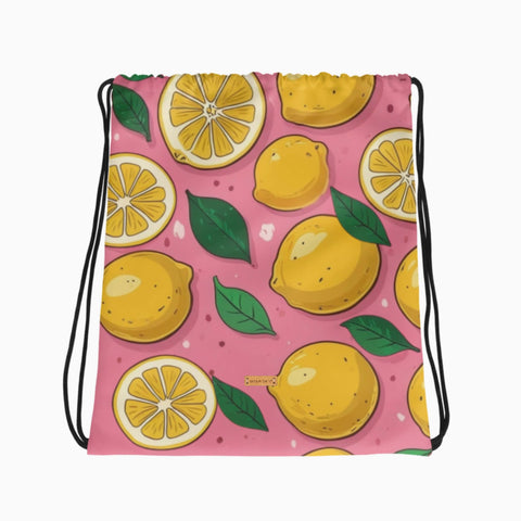 Turnbeutel mit Zitronenmuster auf rosa Hintergrund, flach ausgelegt.