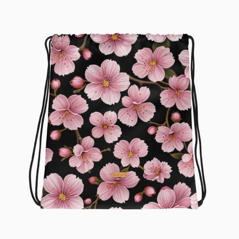 Turnbeutel mit Kirschblütenmuster in Pastellrosa, flach ausgelegt.